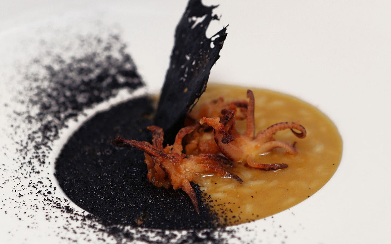 Fumet and Olive Oil “Dirty Rice”, Crispy Calamari, Black Squid Dust